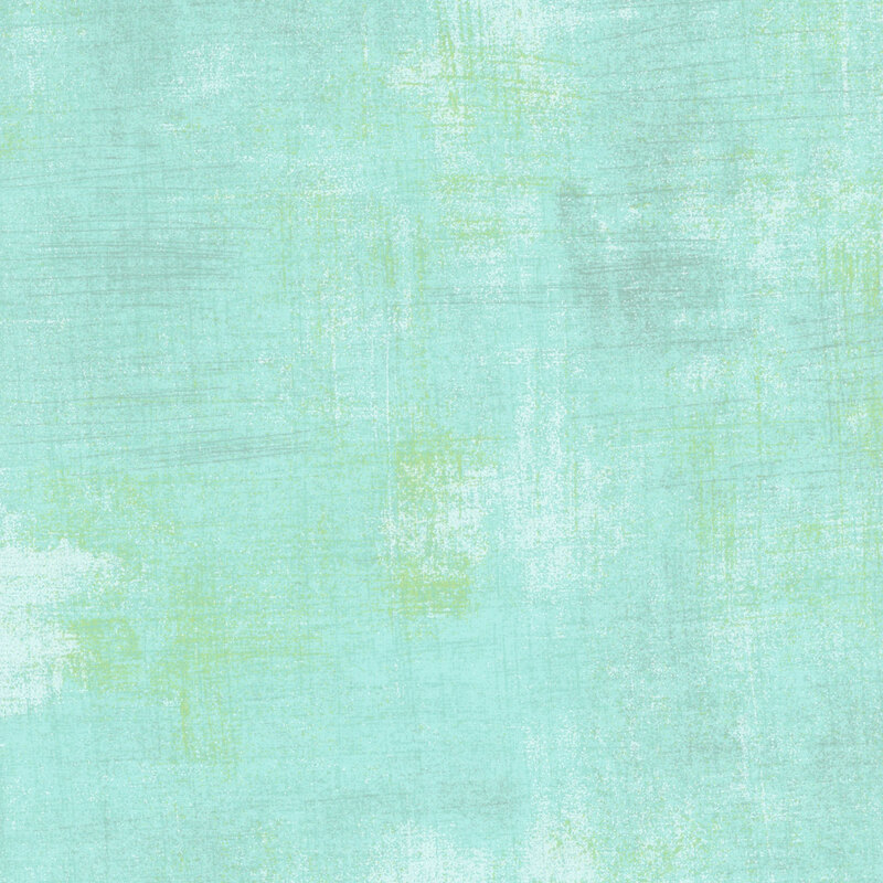 teal mottled and textured fabric