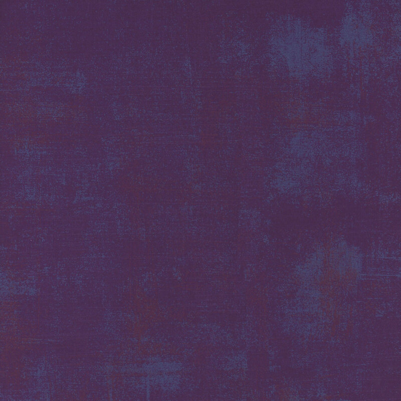 Purple mottled and textured fabric