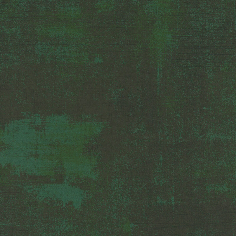 dark green mottled and textured fabric