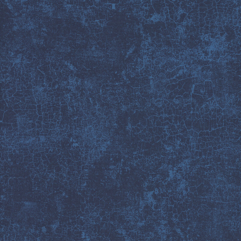 Textured navy blue fabric background with subtle cracks and varying shades of blue.