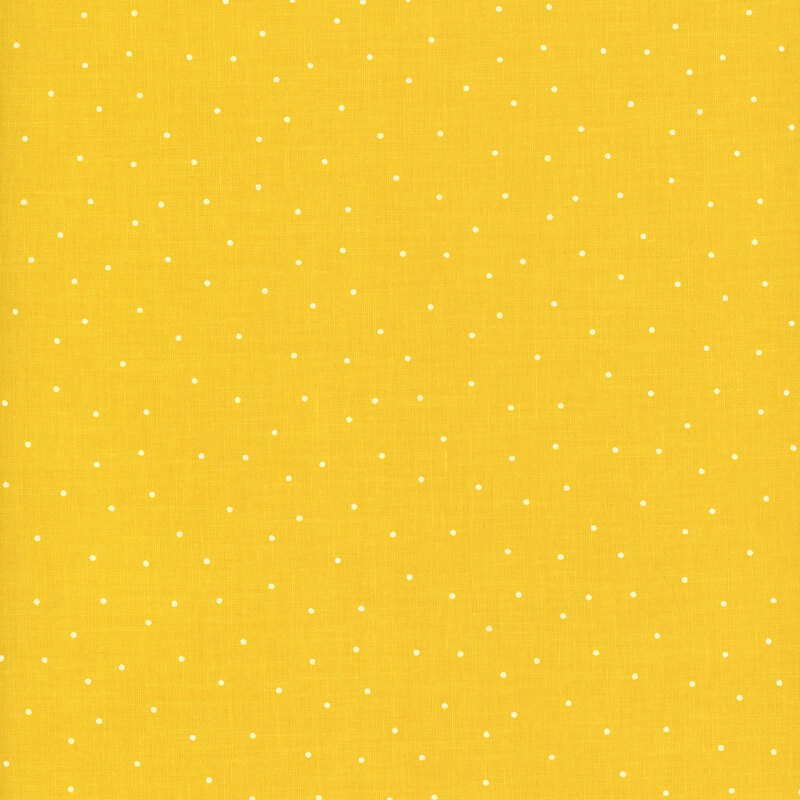 Bright yellow fabric with scattered white pindots.