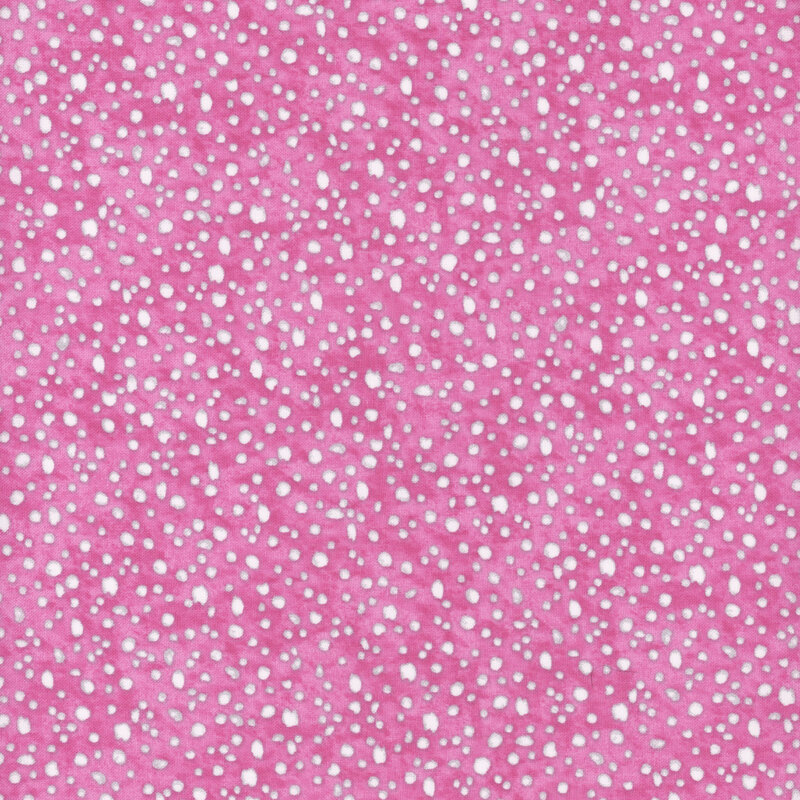 fabric pattern of white dots scattered all over a pink marbled background