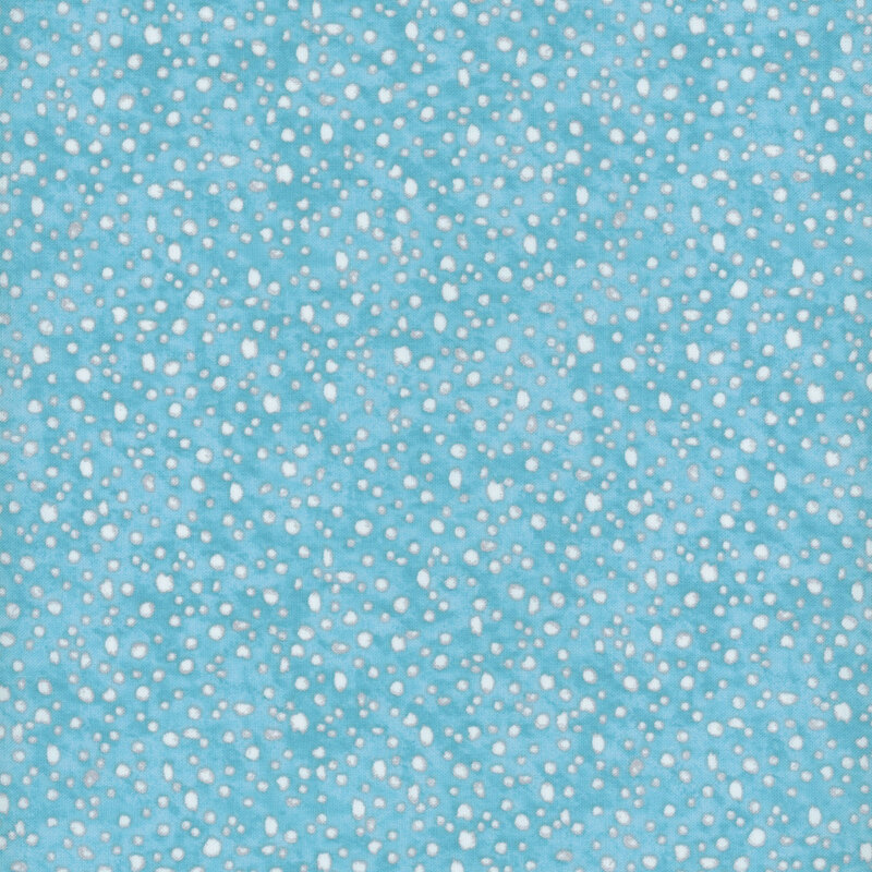 fabric pattern of white dots scattered all over a light blue marbled background