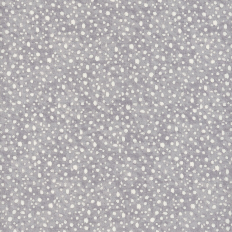 fabric pattern of white dots scattered all over a gray marbled background