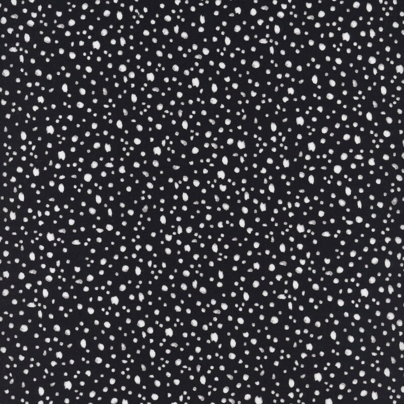 fabric pattern of white dots scattered all over a black marbled background