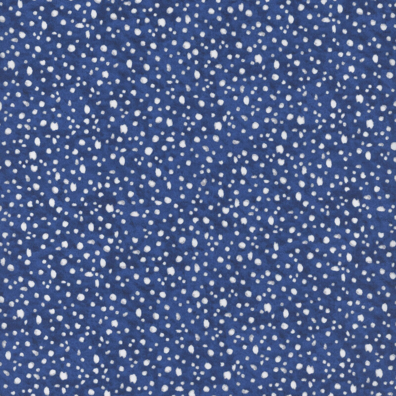 fabric pattern of white dots scattered all over a navy marbled background