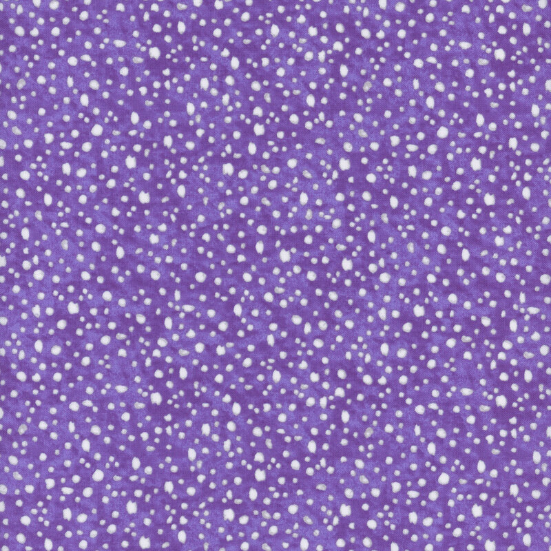 fabric pattern of white dots scattered all over a purple marbled background