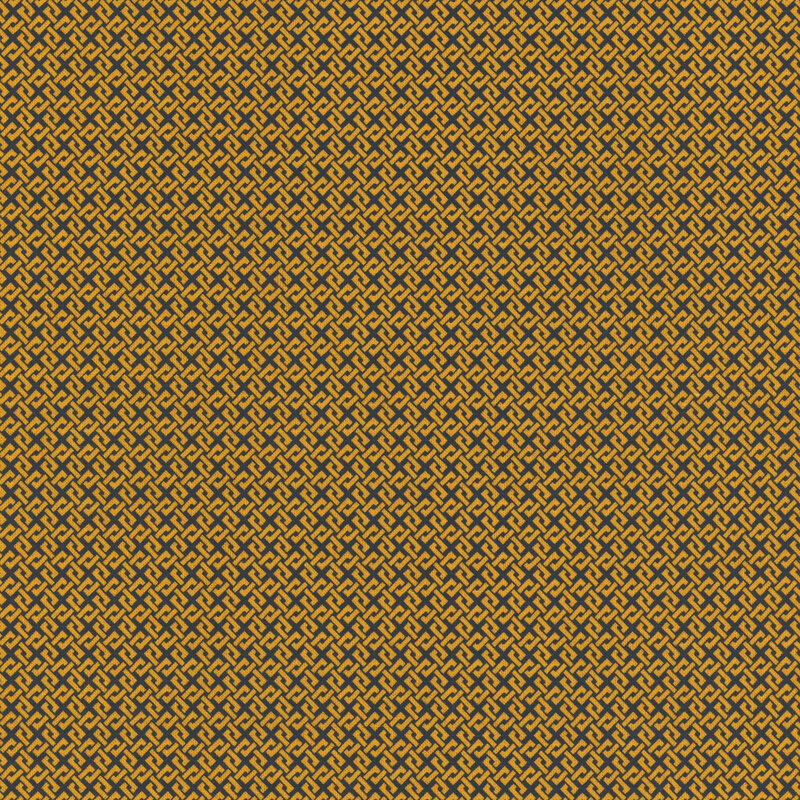 Gold fabric with an interlocking black design.