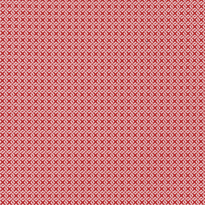 Red fabric with an interlocking white design.