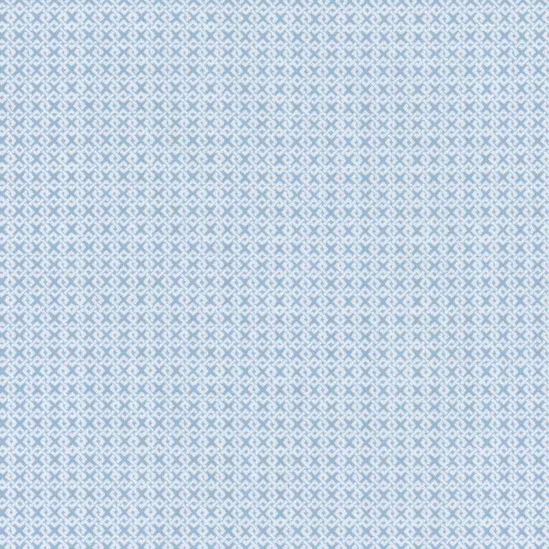 Boy blue fabric with an interlocking white design.