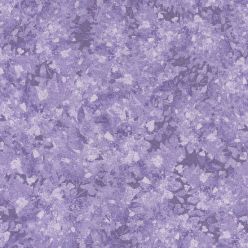 Purple fabric with a mottled and flecked design in different shades.