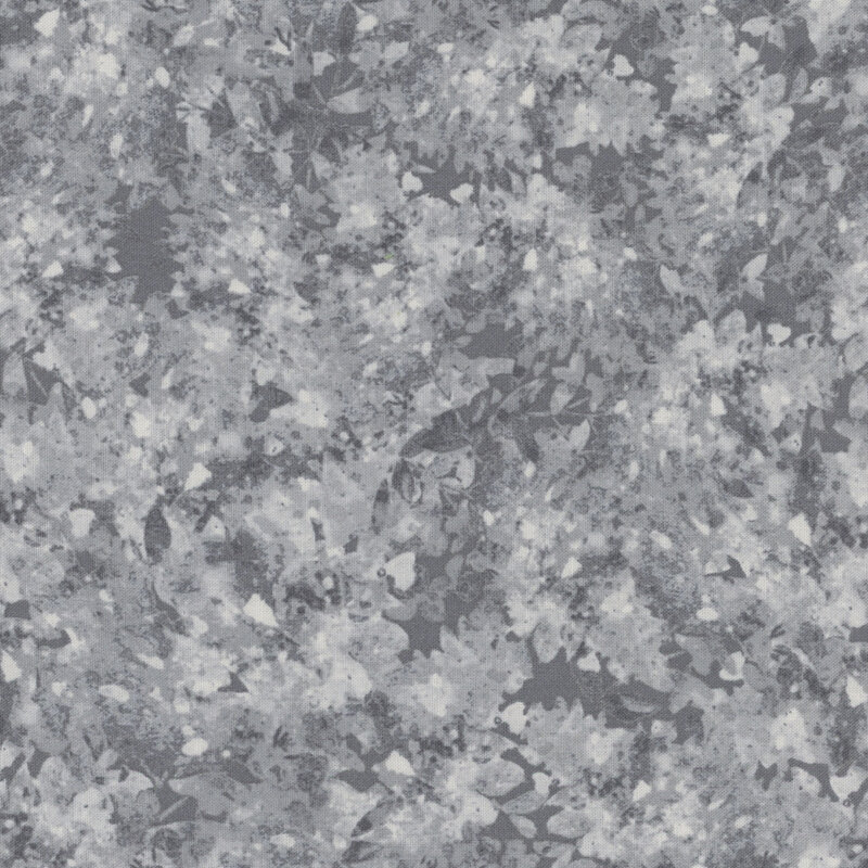 Gray fabric with a mottled and flecked design in different shades.