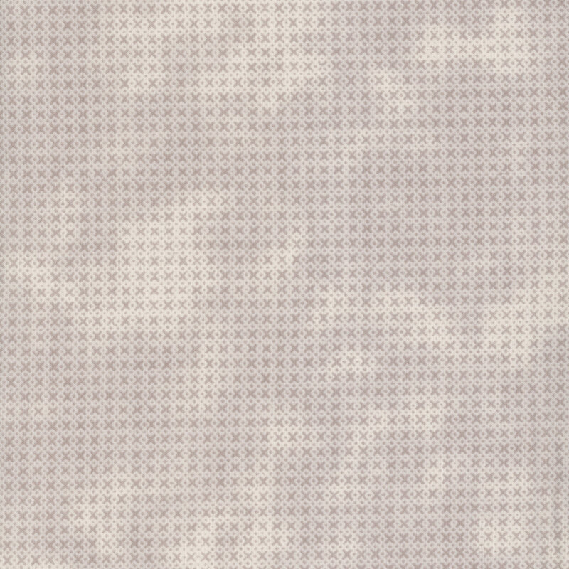 Textured fabric in white and gray mottled colors, featuring a subtle pattern.