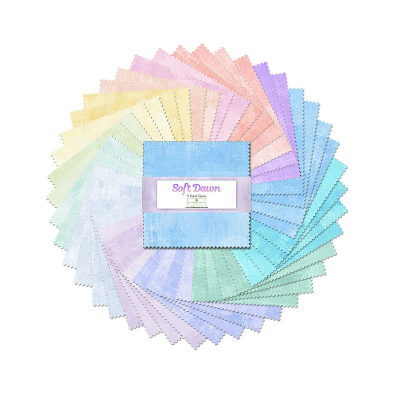 A fanned out collage of the rainbow pastel fabrics included in the Soft Dawn 5 Karat Gems set.