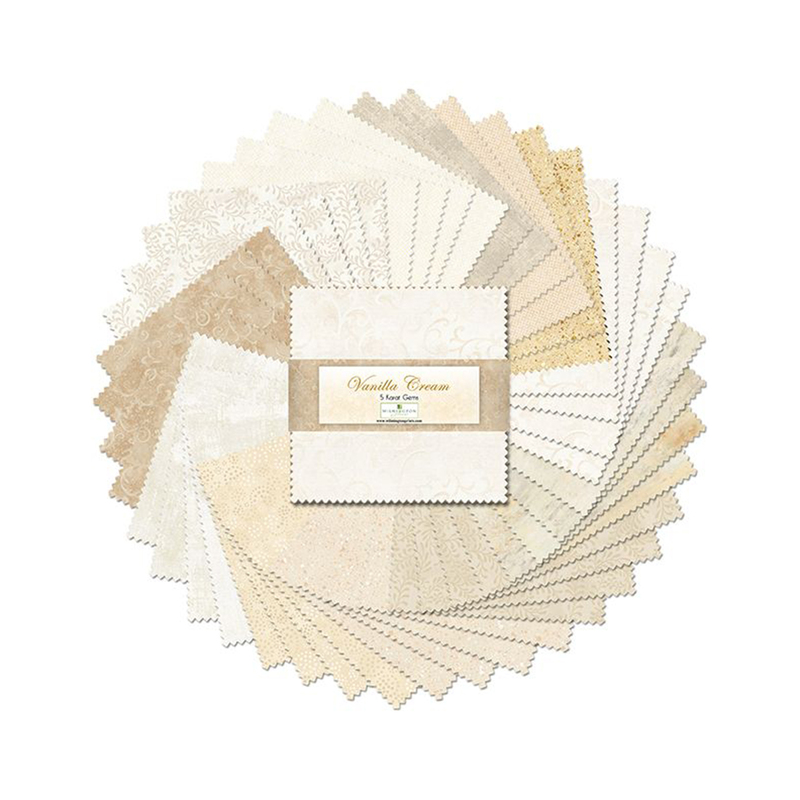 A fanned out collage of the cream fabrics included in the Vanilla Cream 5 Karat Gems set.