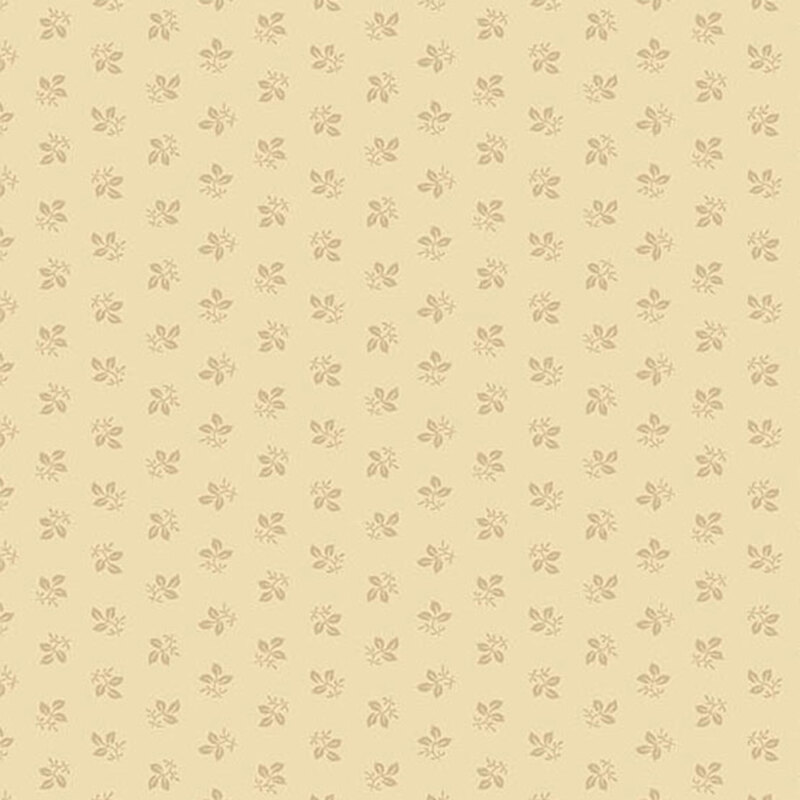 Cream fabric with rows of tonal, ditsy leaves.