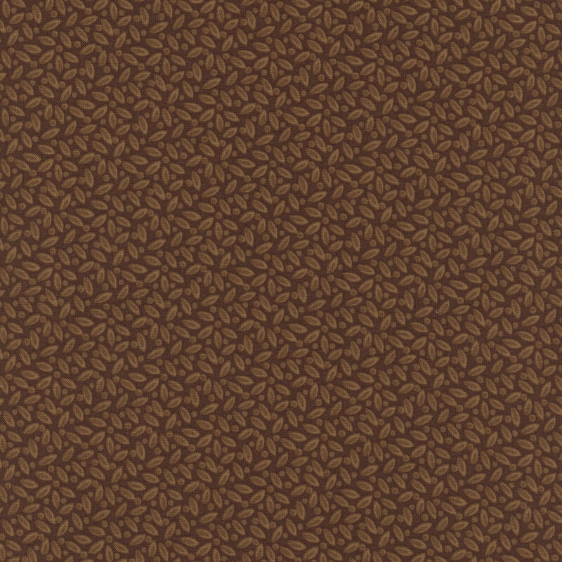 Brown fabric with a packed, tonal leafy design.
