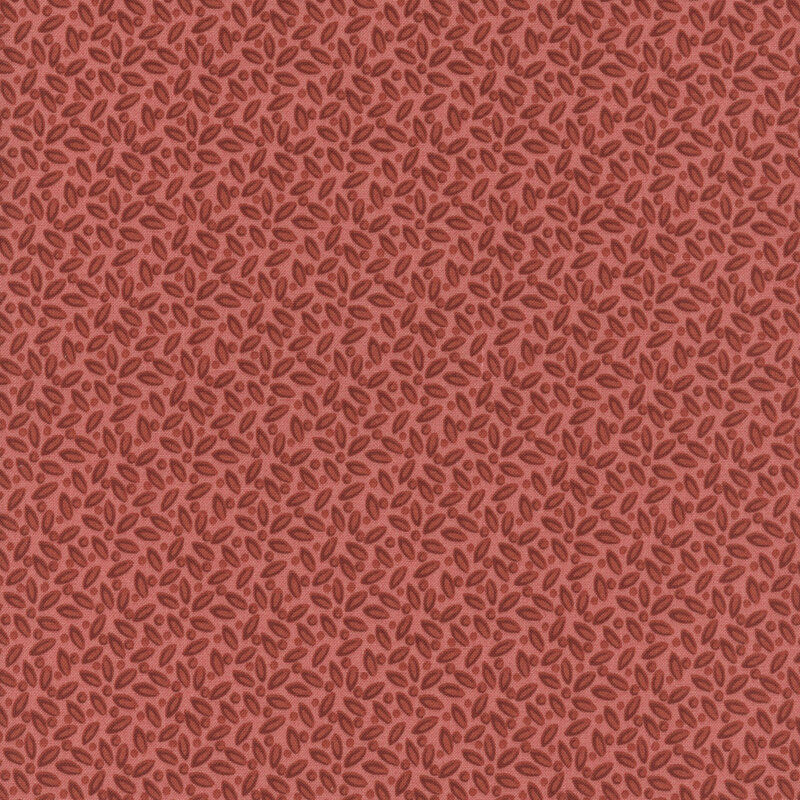 Red fabric with a packed, tonal leafy design.