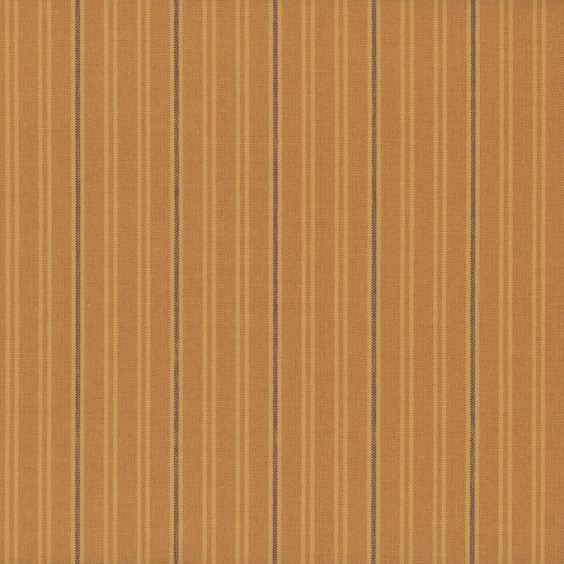 Fabric with vertical stripes in warm orange and light yellow tones.