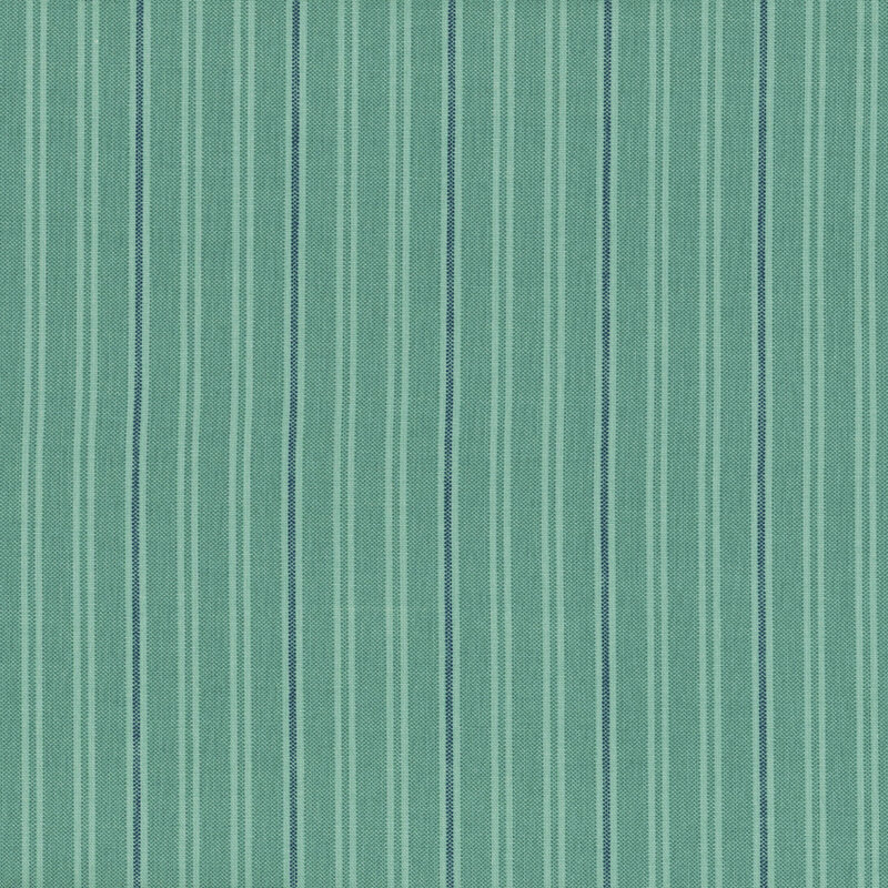Fabric with vertical stripes in varying shades of teal and light blue.