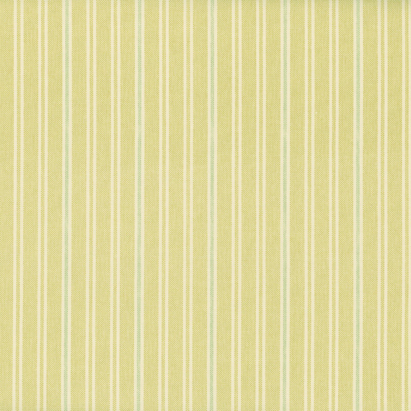Light yellow fabric pattern with thin vertical lines in pale green and cream.