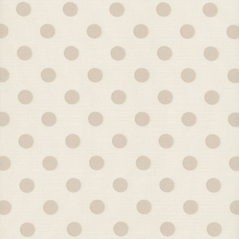 Light beige fabric with evenly spaced, round polka dots in a slightly darker shade.