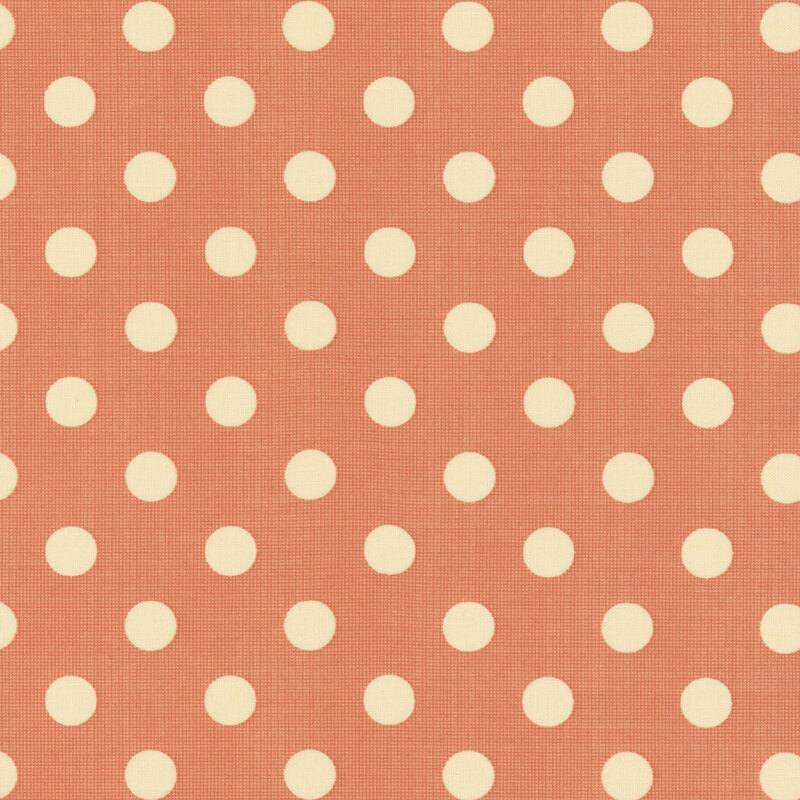 Pattern of cream-colored polka dots on a copper fabric, evenly spaced and symmetrical.