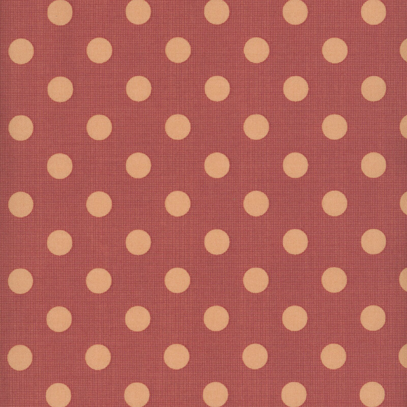A fabric featuring a repeating pattern of cream-colored dots on a rust-colored surface.