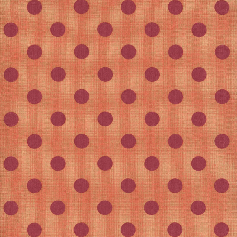 Repeating pattern of maroon polka dots on a dark orange background.