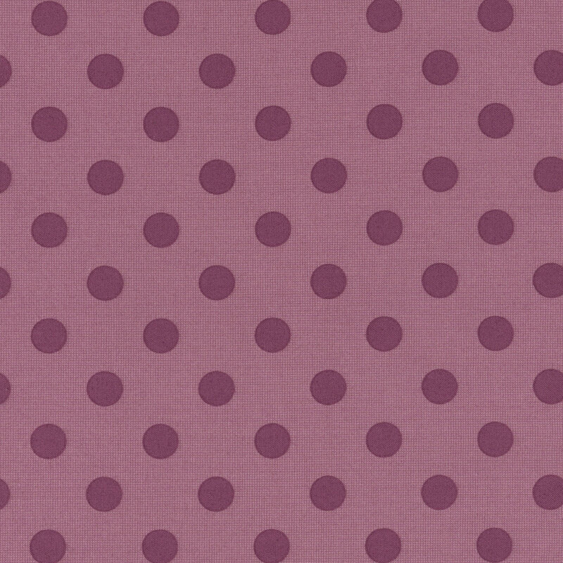 Fabric pattern of evenly spaced dark purple polka dots.