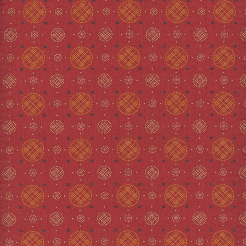 Red fabric with a uniform arrangement of plaid circles and polka dots. 