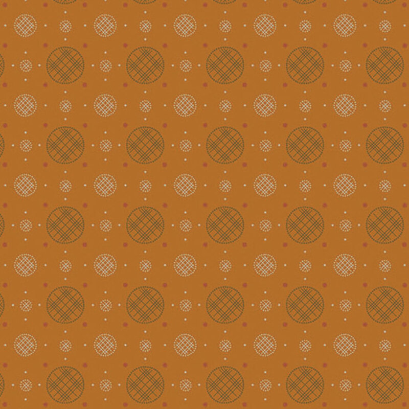 Golden orange fabric with a uniform arrangement of plaid circles and polka dots. 