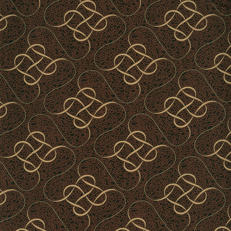 Orange dots on black fabric with an intricate, intertwined design on a dotted background.