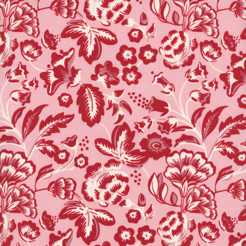Pink fabric with sprawling illustrations of red and white leaves and flowers.