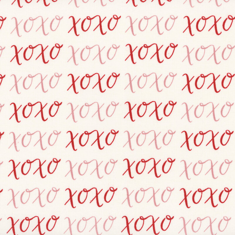 Cream fabric with pink and red XOXO's.
