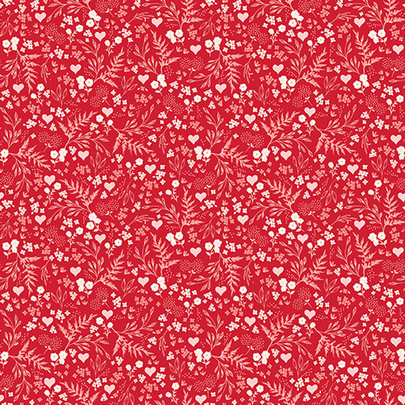 Red fabric with a busy design of hearts, flowers, and ferns.