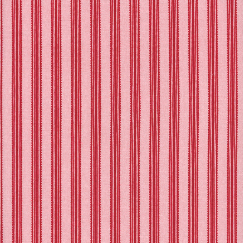 Pink fabric with red ribbon stripes.