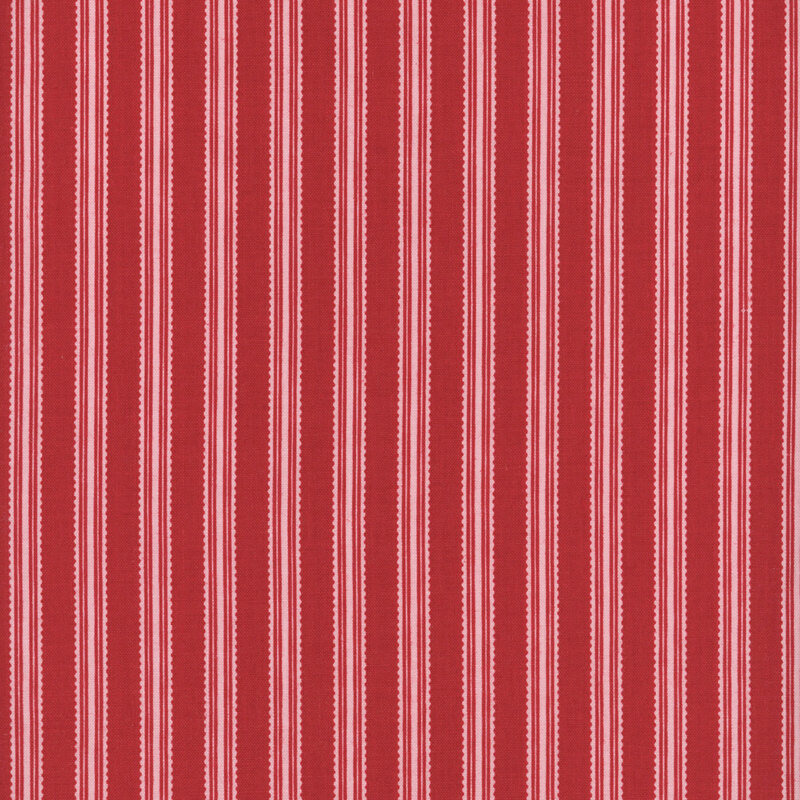 Red fabric with pink ribbon stripes.