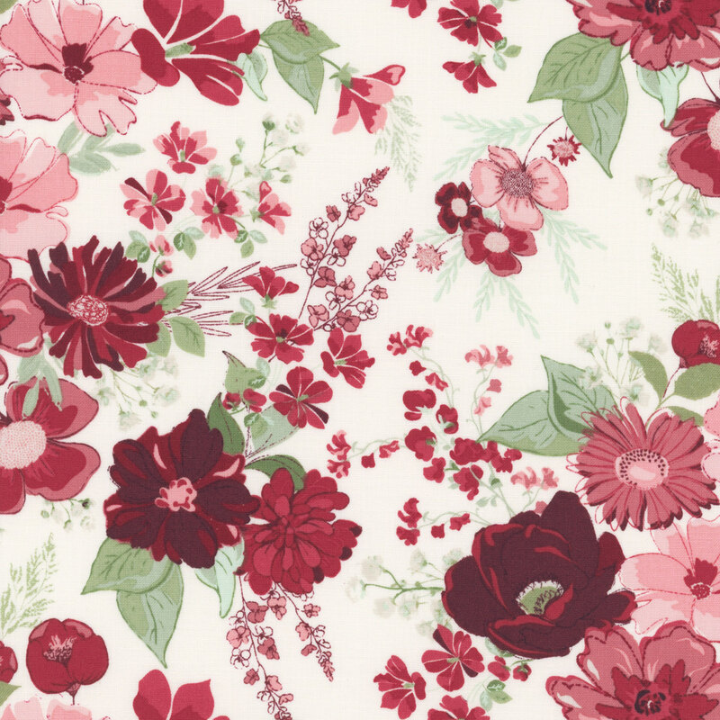 Colorful floral pattern featuring various flowers in shades of red, pink, and green on a light fabric.