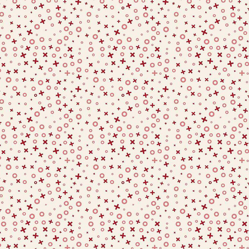 Repeating pattern of red circles and crosses on a light cream fabric.