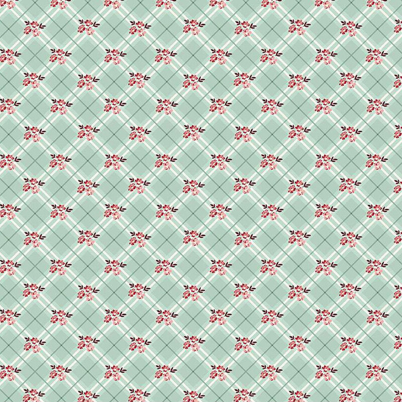 Patterned fabric featuring a light green fabric with a repeated design of small red flowers and diagonal lines.