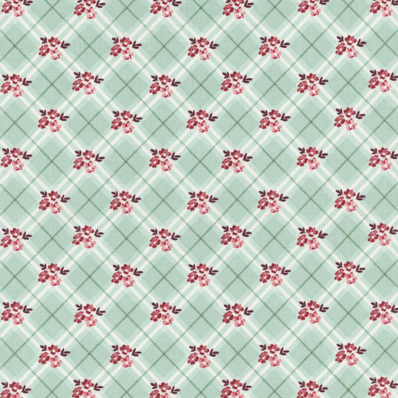 Patterned fabric featuring a light green fabric with a repeated design of small red flowers and diagonal lines.