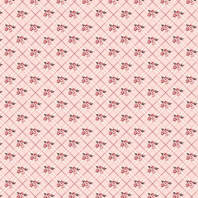 Light pink fabric with a diagonal grid pattern, featuring small red flowers.