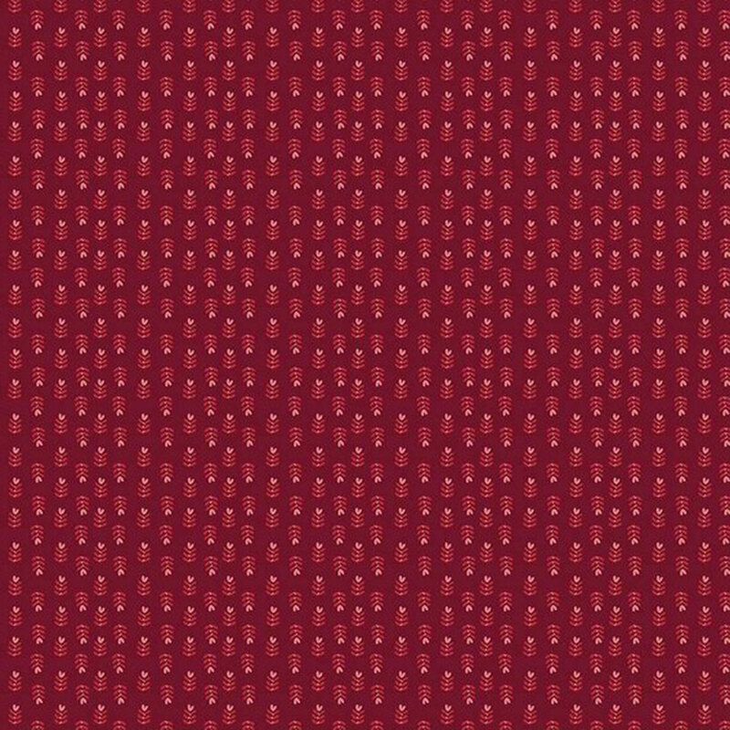 Red fabric with a repetitive pattern of small, intricate designs in a slightly lighter shade.