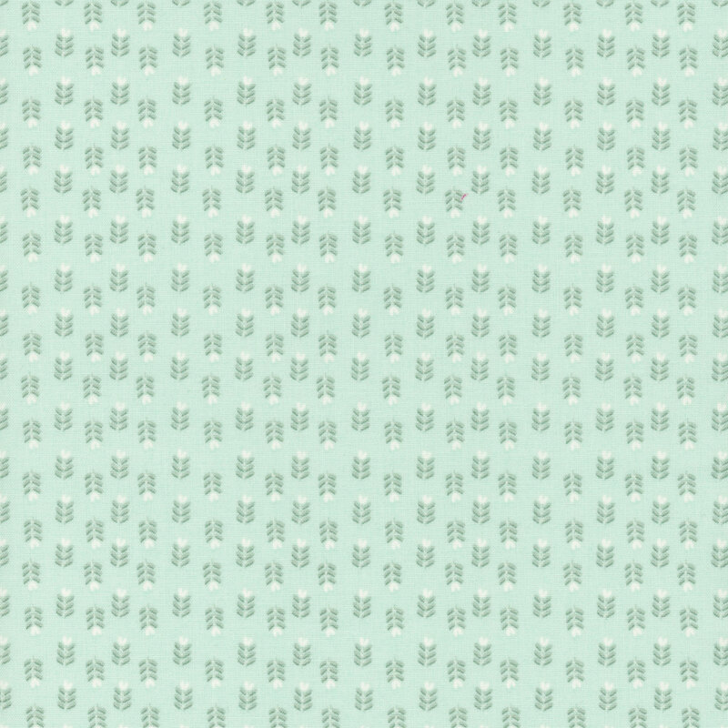Repeating pattern of small grey florals on a light mint green fabric.
