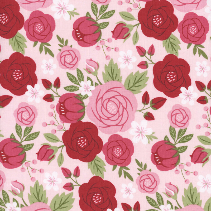 fabric pattern of roses scattered on a light pink background