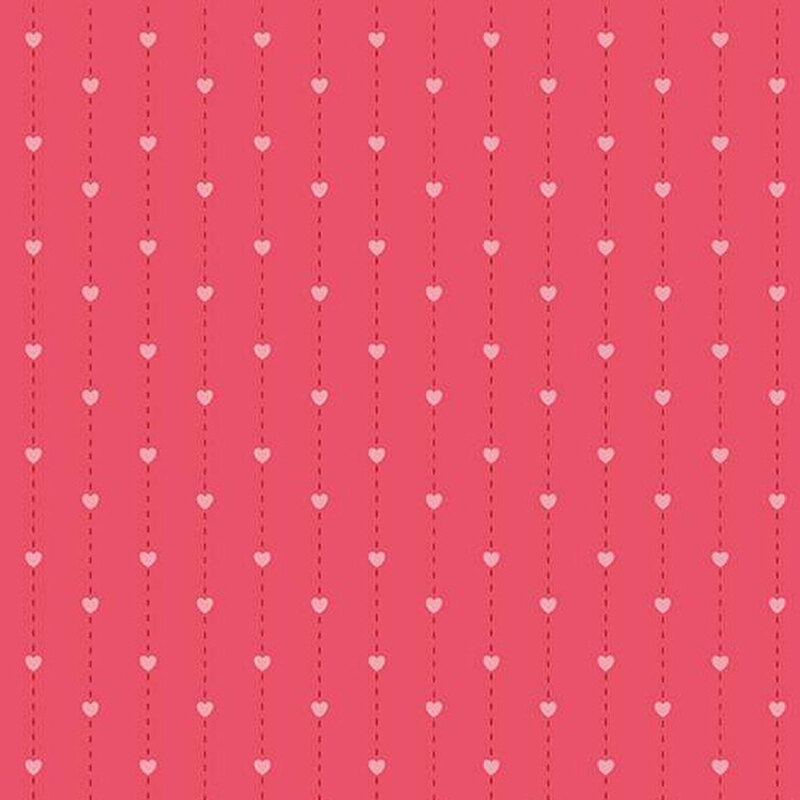 fabric pattern of pink hearts over a deep pink background