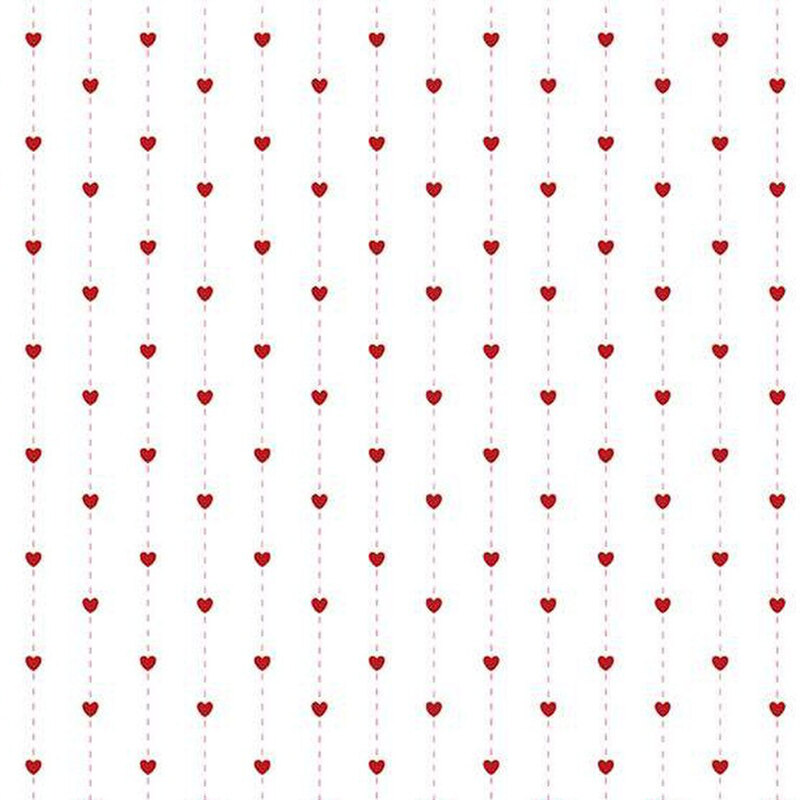 fabric pattern of red hearts over a white background