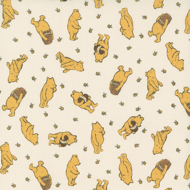 A cream fabric featuring tossed images of winnie the pooh, honey bees and honey pots.
