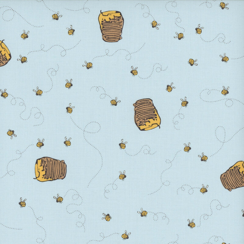A blue fabric with honey jars and swirling honey bees.